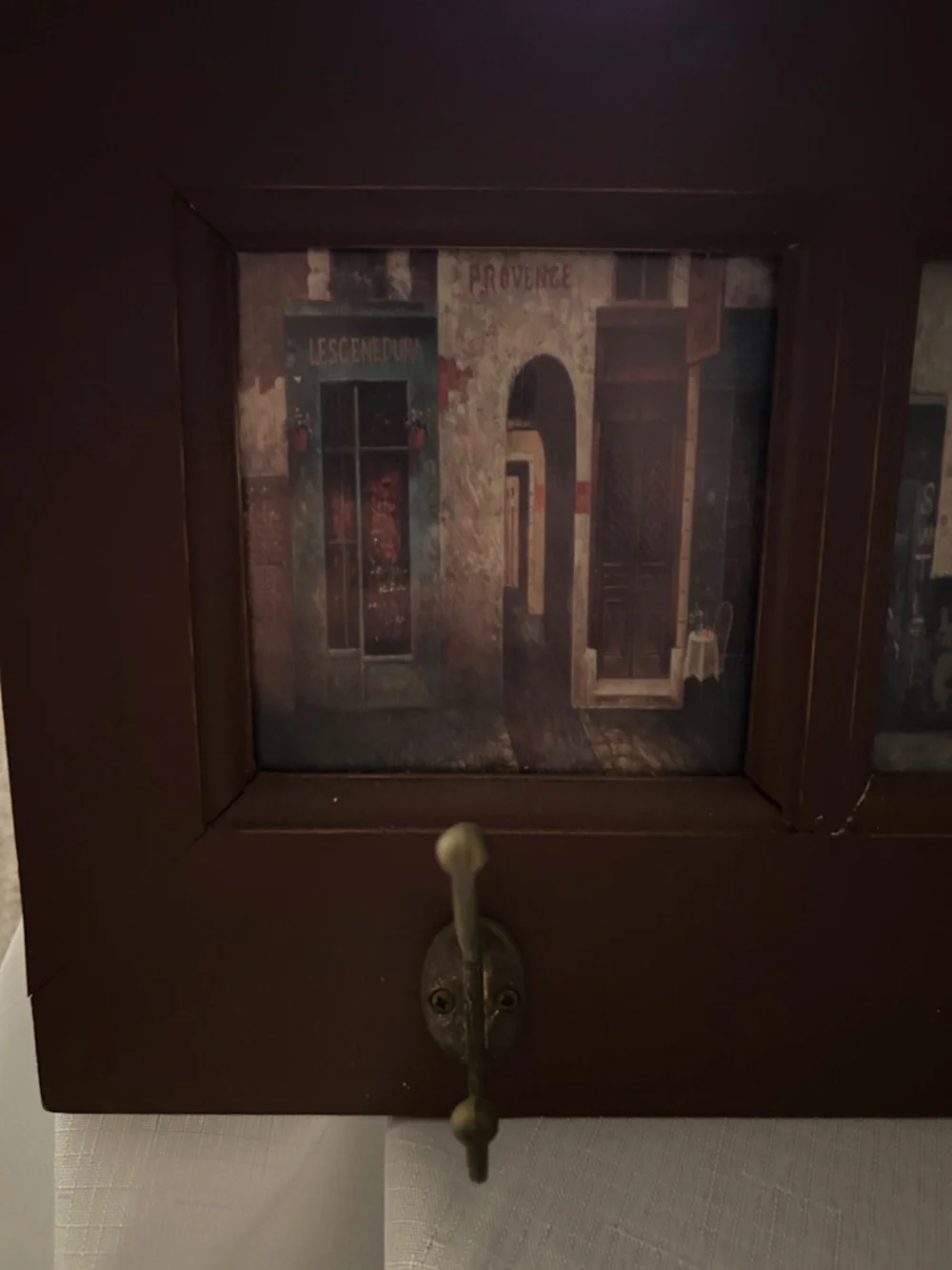 Wall-Mount Coat Rack with Brown Frame and Vintage Artwork